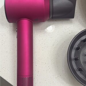 Pink Dyson hairdryer with Diffuser Attachment
